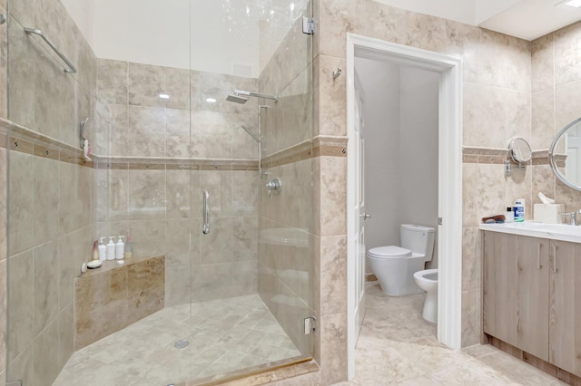 full bathroom with toilet, a bidet, tile walls, a shower stall, and vanity