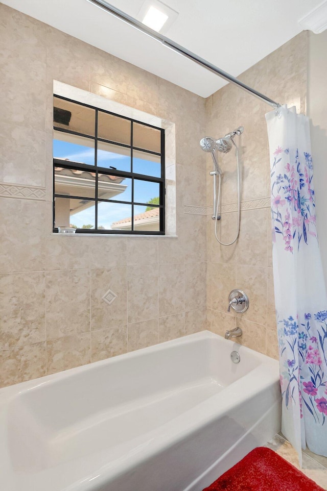 full bathroom featuring shower / bath combination with curtain