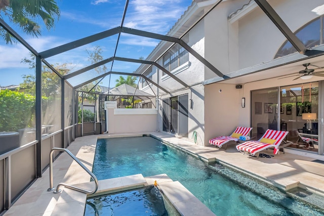 view of swimming pool with a patio area, a pool with connected hot tub, a lanai, and a ceiling fan