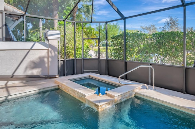 view of pool with a lanai and an in ground hot tub