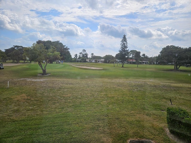 view of property's community featuring a yard