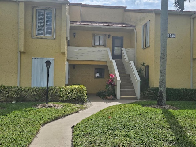 view of property featuring stairway