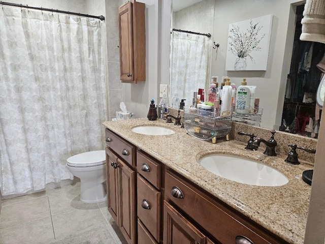 full bath featuring tile patterned flooring, double vanity, toilet, and a sink