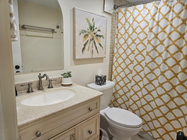 full bath featuring curtained shower, toilet, and vanity