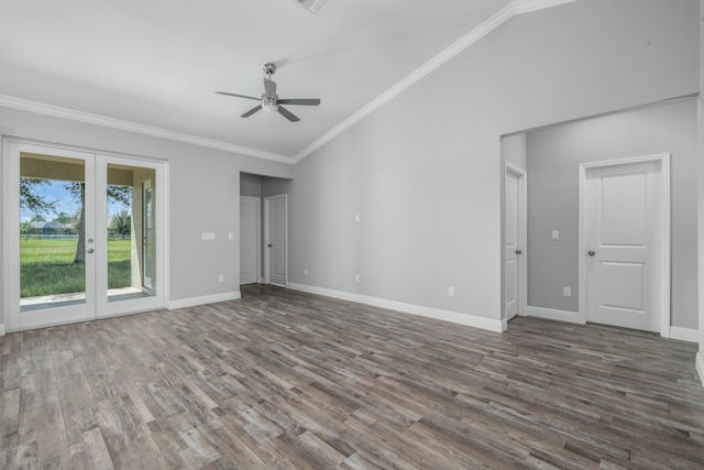 interior space with baseboards, vaulted ceiling, dark wood-type flooring, french doors, and crown molding