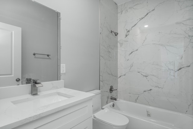 bathroom with toilet, vanity, and shower / bathing tub combination