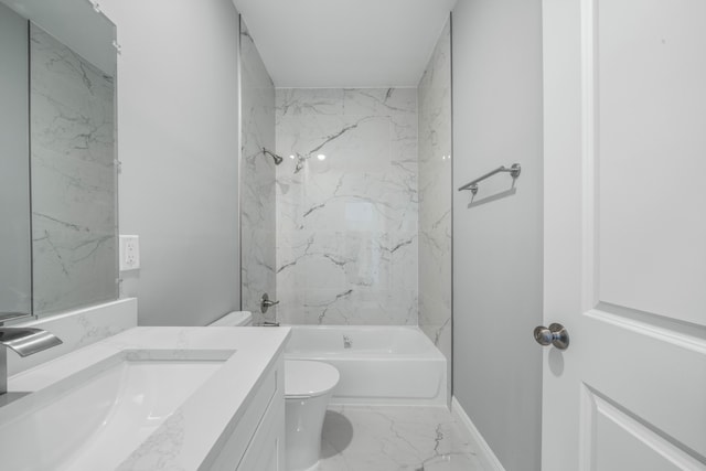 bathroom featuring vanity, baseboards, bathing tub / shower combination, toilet, and marble finish floor