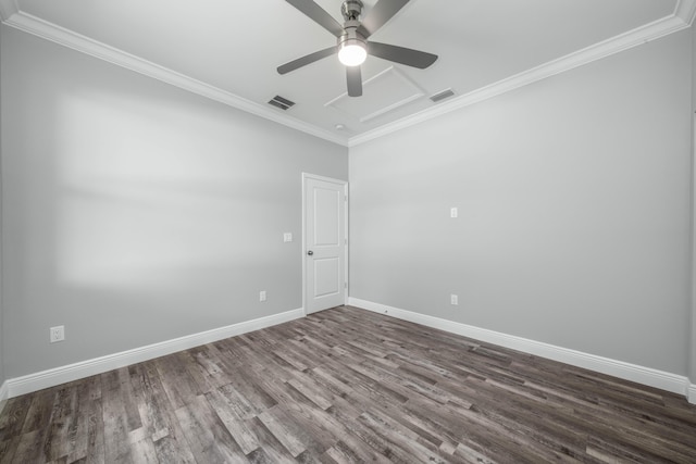 empty room featuring crown molding and visible vents