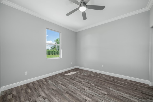 spare room with baseboards, a ceiling fan, dark wood-style flooring, and crown molding