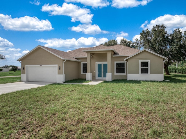 ranch-style house featuring a front yard, french doors, a garage, and driveway