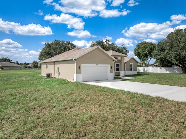 single story home with a garage, driveway, a front yard, and fence