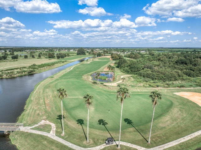 aerial view with a water view and view of golf course