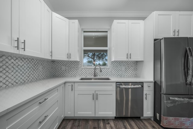 kitchen featuring a sink, light countertops, white cabinets, and stainless steel appliances