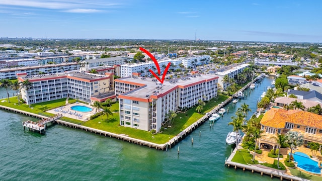 birds eye view of property with a water view