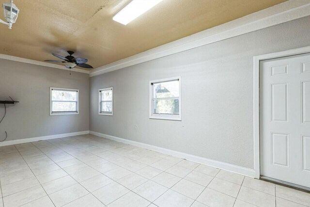 unfurnished room featuring visible vents, baseboards, ceiling fan, and light tile patterned flooring