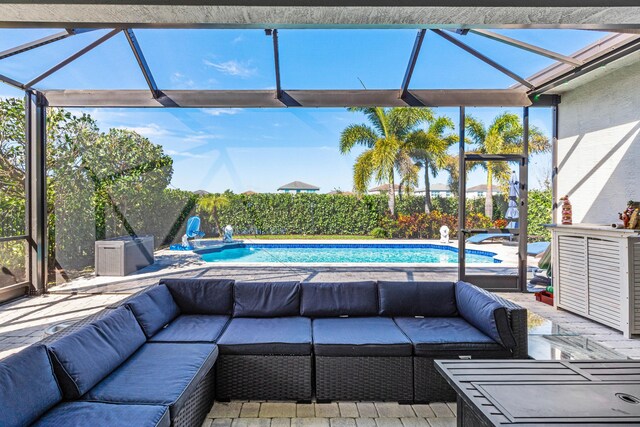 view of patio with a fenced in pool, a lanai, and outdoor lounge area