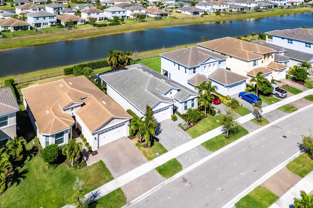 bird's eye view with a residential view and a water view