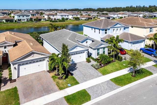 bird's eye view with a residential view and a water view