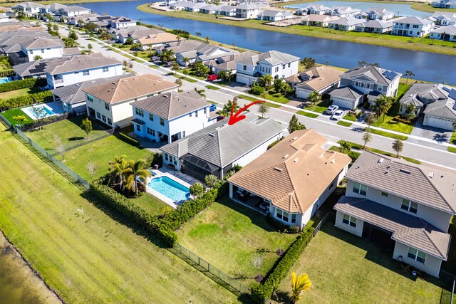 bird's eye view featuring a residential view and a water view