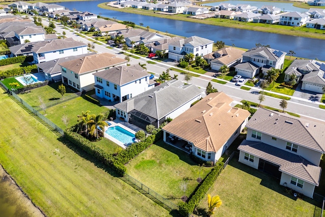 birds eye view of property featuring a residential view and a water view