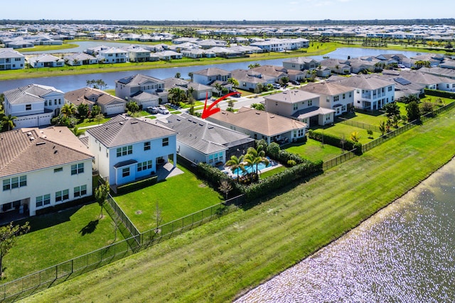 bird's eye view featuring a residential view and a water view