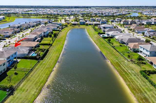 birds eye view of property featuring a residential view and a water view