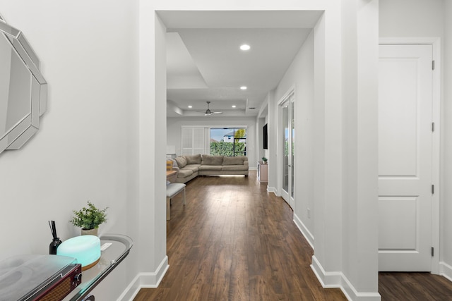 hallway with recessed lighting, dark wood-style floors, and baseboards