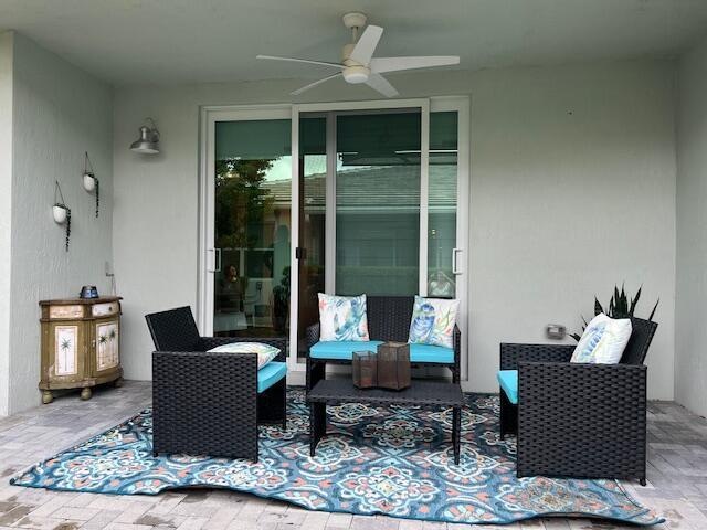 view of patio / terrace featuring ceiling fan