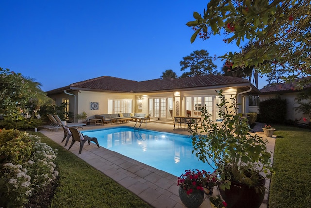 pool featuring a patio, french doors, and an outdoor hangout area