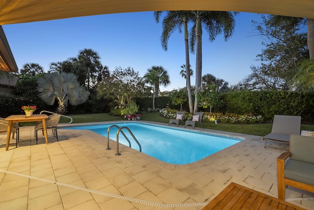 pool with a patio