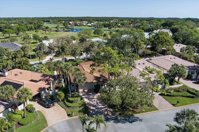 drone / aerial view with a water view and a residential view