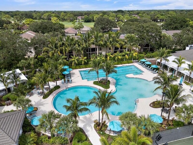 community pool with a patio area