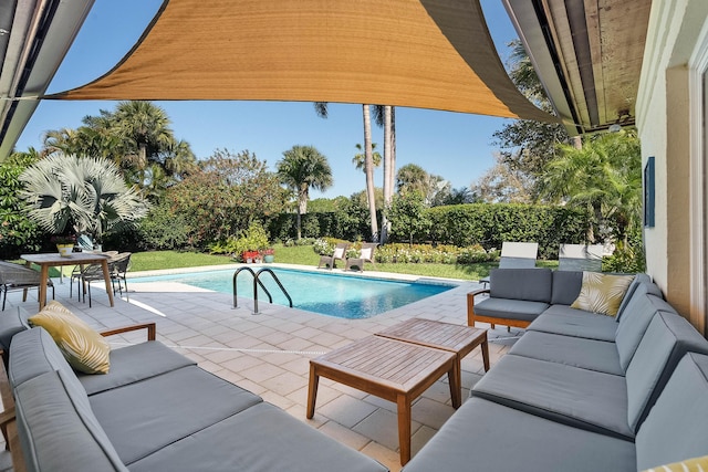 view of swimming pool with a patio area, a fenced in pool, outdoor lounge area, and a yard