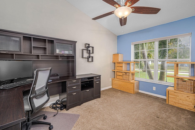 office area with a ceiling fan, lofted ceiling, light colored carpet, and baseboards