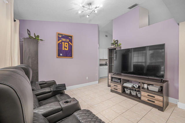 living room with light tile patterned floors, visible vents, baseboards, and a chandelier