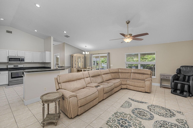 living room with light tile patterned floors, visible vents, ceiling fan with notable chandelier, and vaulted ceiling