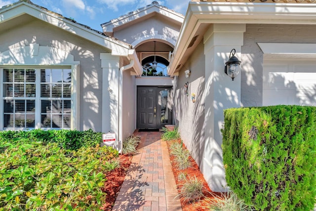 doorway to property with stucco siding