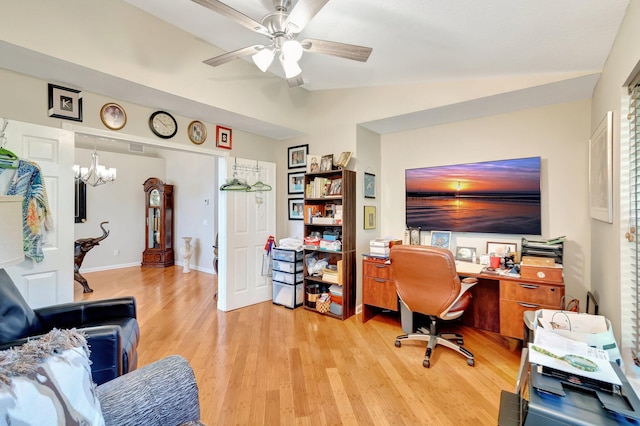 home office featuring a ceiling fan, vaulted ceiling, and light wood finished floors