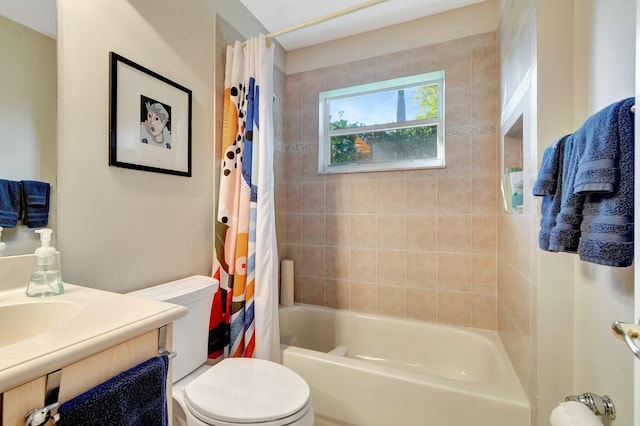 bathroom featuring vanity, toilet, and shower / bathtub combination with curtain