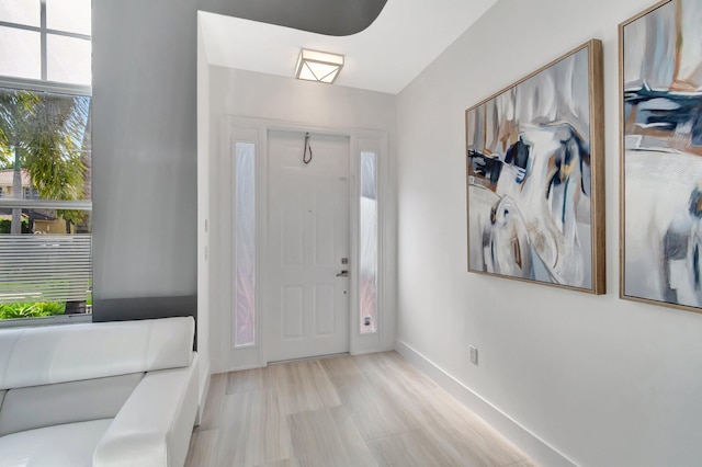 foyer entrance with baseboards