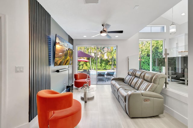 living area with recessed lighting and ceiling fan