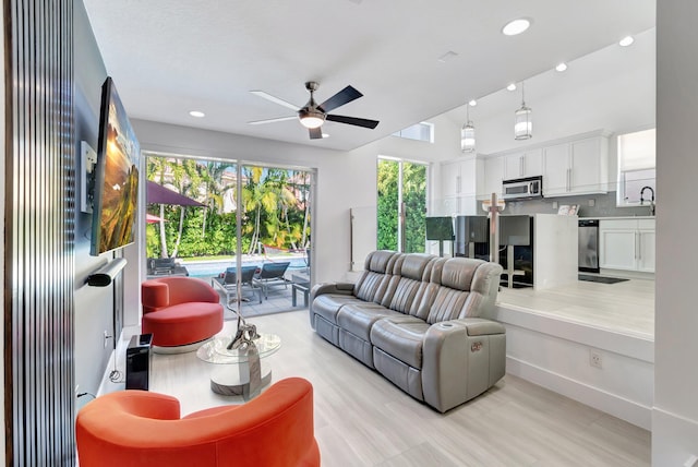 living area with recessed lighting, a ceiling fan, and visible vents