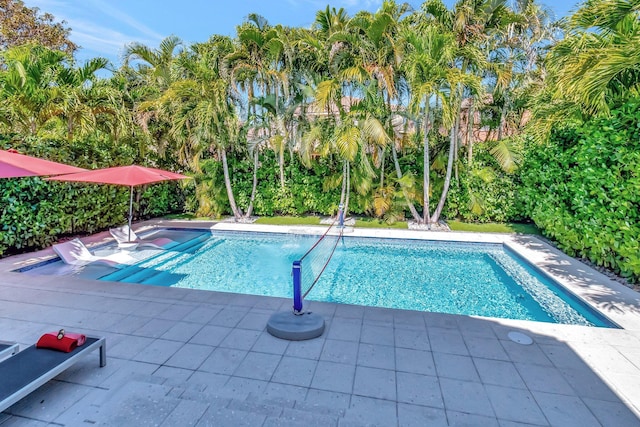 outdoor pool with a patio