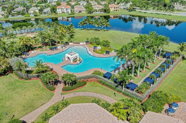 drone / aerial view with a water view and a residential view