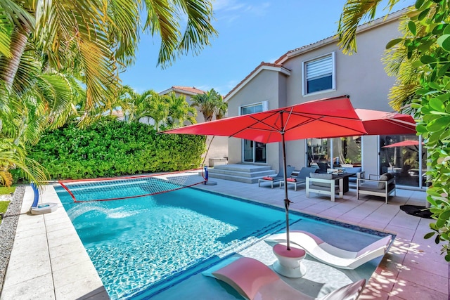 outdoor pool featuring a patio