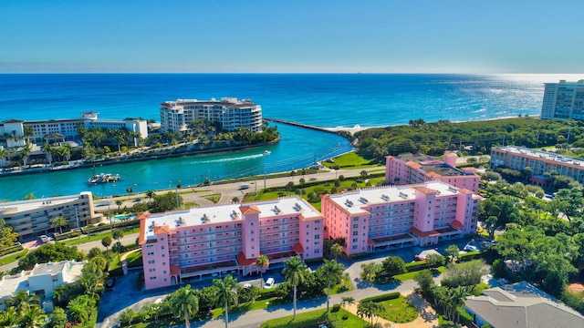 drone / aerial view featuring a city view and a water view