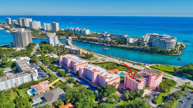 birds eye view of property featuring a water view and a view of city