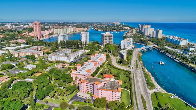 birds eye view of property featuring a water view and a view of city