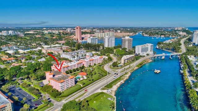 birds eye view of property with a view of city and a water view