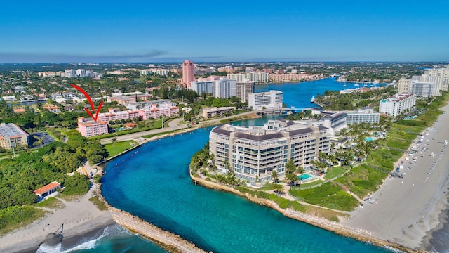 aerial view featuring a view of the beach, a view of city, and a water view